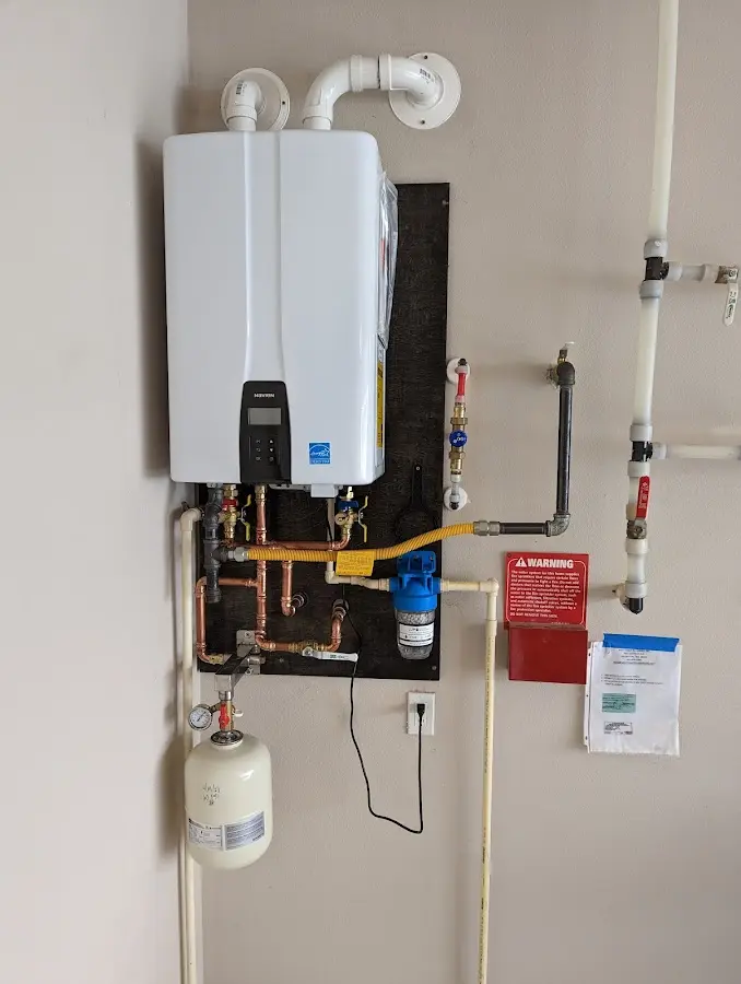 Professional plumber installing copper piping in a Bowleys Quarters home